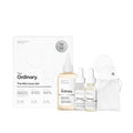 SlimBag The Ordinary Mini Icons Set with travel-sized glycolic acid toner, niacinamide, hyaluronic acid, and reusable rounds for skincare.